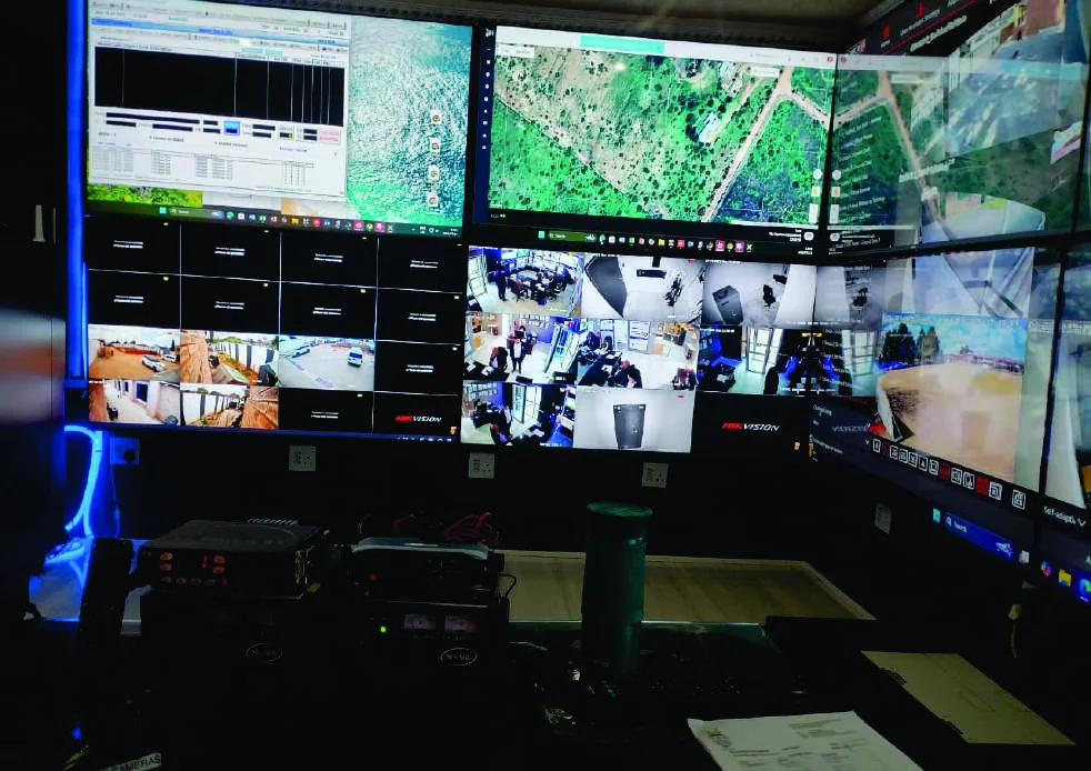 Security personnel monitoring CCTV in a control room